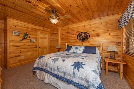 Bedroom with log bed, night stands, and lamps at Sensational Views, a 3 bedroom cabin rental located in Gatlinburg