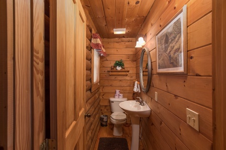 Half bath at Hanky Panky, a 1-bedroom cabin rental located in Pigeon Forge