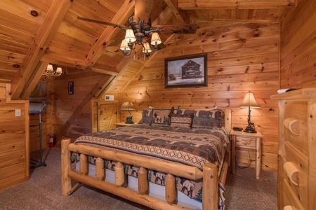 king sized log bed in a loft at always & forever a 1 bedroom cabin rental located in pigeon forge