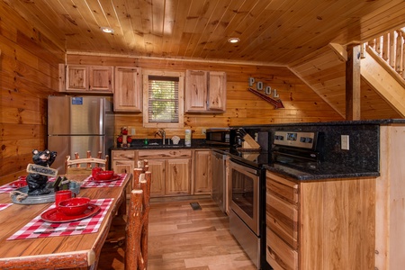 Kitchen with stainless appliances at Canyon Camp Falls, a 2 bedroom cabin rental located in Pigeon Forge
