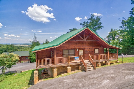 Exterior view of the parking and cabin at Majestic Sunrise, a 1 bedroom cabin rental located in Pigeon Forge