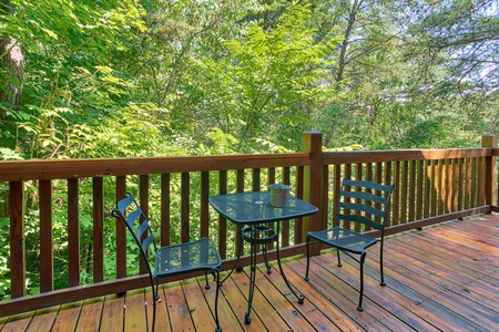 bistro set on the deck at alpine sunset thrill a 1 bedroom cabin rental located in pigeon forge