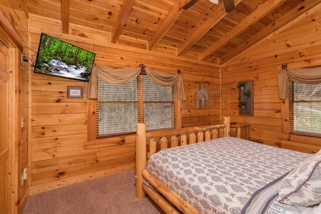 TV in the bedroom at Mountain View Meadows, a 3 bedroom cabin rental located in Pigeon Forge