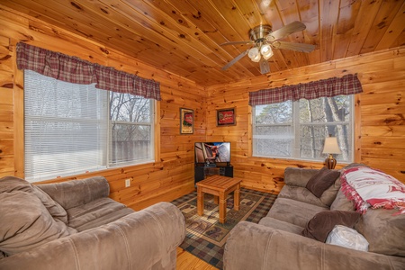 Lower living room at Hickernut Lodge, a 5-bedroom cabin rental located in Pigeon Forge