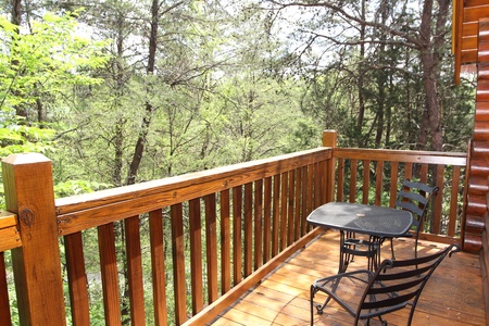 bistro set on the deck at alpine sunset thrill a 1 bedroom cabin rental located in pigeon forge