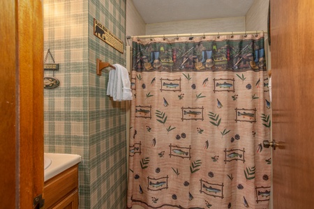 Bathroom with a tub and shower at Black Bear Ridge, a 3-bedroom cabin rental located in Pigeon Forge