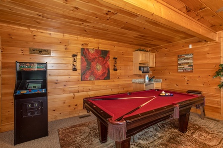 Pool table and arcade game at Better View, a 4 bedroom cabin rental located in Pigeon Forge
