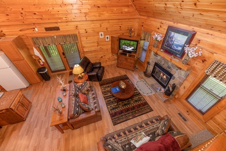 Looking down into the living room at Grand View, a 3 bedroom cabin rental located in Sevierville