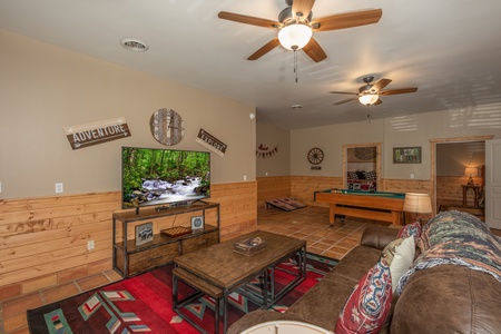 Living room with pool table at Hawk's Heart Lodge, a 3 bedroom cabin rental located in Pigeon Forge