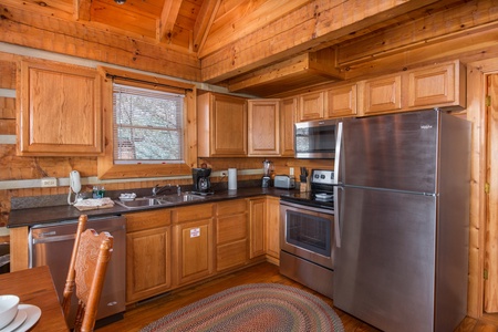 Kitchen with stainless appliances at Ella-Vation, a 3 bedroom cabin rental located in Gatlinburg
