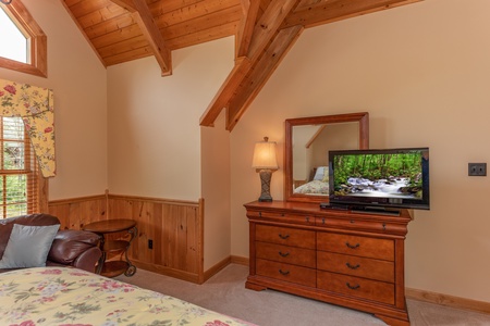 Dresser and TV in the loft bedroom at Mountain Lake Getaway, a 3 bedroom cabin rental located at Douglas Lake
