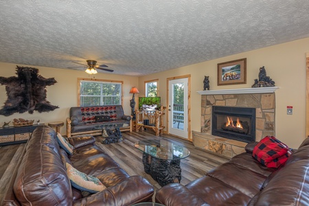 Living room with fireplace at Le Bear Chalet, a 7 bedroom cabin rental located in Gatlinburg