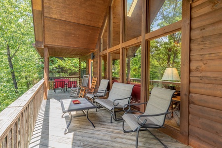 Covered main deck with chairs at Hello Dolly, a 1 bedroom cabin rental located in Pigeon Forge
