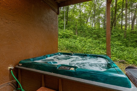 Hot tub at Hawk's Heart Lodge, a 3 bedroom cabin rental located in Pigeon Forge