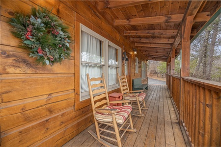 Rocking chairs out on the front porch at Fox Ridge, a 3 bedroom cabin rental located in Pigeon Forge