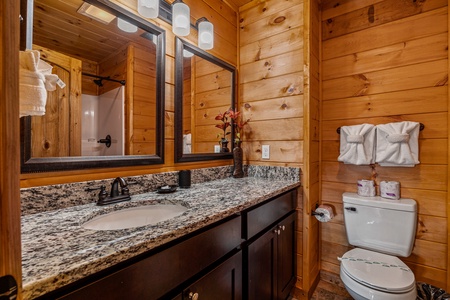 Bathroom sink with double mirrors at Four Seasons Grand, a 5 bedroom cabin rental located in Pigeon Forge