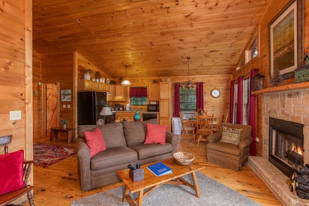 Open concept living space with fireplace at A View for You, a 1 bedroom cabin rental located in Pigeon Forge