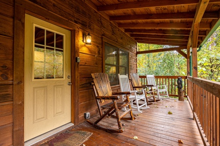 Front Door and Deck with Rockers at Tammy's Place At Baskins Creek, a 2 bedroom cabin rental located in gatlinburg