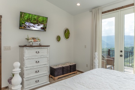 Dresser and TV in a bedroom at Mountain Celebration, a 4 bedroom cabin rental located in Gatlinburg