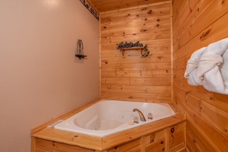 Corner jacuzzi tub in a bedroom at Bearly in the Mountains, a 5-bedroom cabin rental located in Pigeon Forge