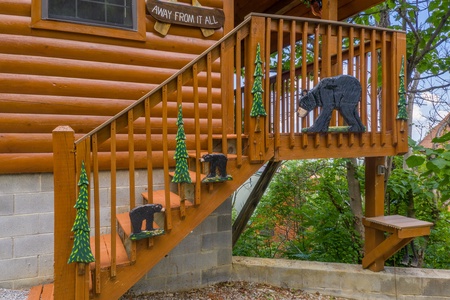 Custom woodwork on the stairs at Away From it All, a 1 bedroom cabin rental located in Pigeon Forge