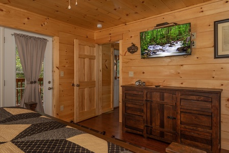 Dresser and TV in a bedroom at Gar Bear's Hideaway, a 3 bedroom cabin rental located in Pigeon Forge