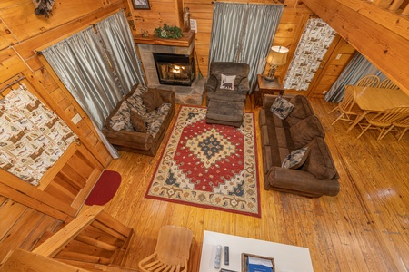 Looking down at the living room from the loft at Fox Ridge, a 3 bedroom cabin rental located in Pigeon Forge