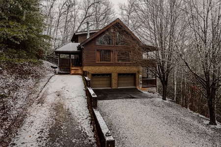 Snowy front of Laid Back a 2 bedroom cabin rental located in Pigeon Forge
