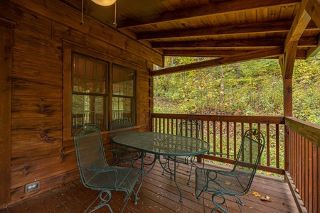 Table and Chairs under Covered Deck at Tammy's Place At Baskins Creek