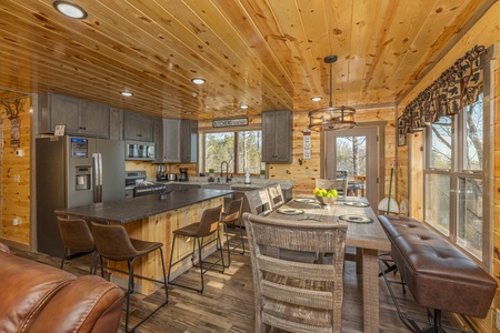 Dining table and breakfast bar at Everly's Splash, a 4 bedroom cabin rental located in Pigeon Forge