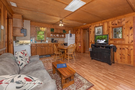 Living, dining, and kitchen space at Heavenly Hideaway, a 2-bedroom cabin rental located in Gatlinburg