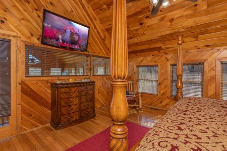 Dresser and TV in a bedroom at Hatcher Mountain Retreat a 2 bedroom cabin rental located in Pigeon Forge