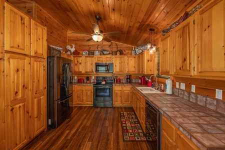 Kitchen at Hawk's Heart Lodge, a 3 bedroom cabin rental located in Pigeon Forge