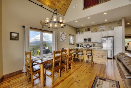 Dining table and breakfast bar at The Best View Lodge, a 5 bedroom cabin rental located in gatlinburg