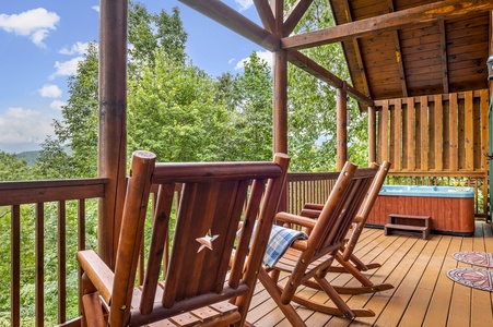 Hot tub on Covered deck with rocking chairs and mountain view at Bear Sunrise
