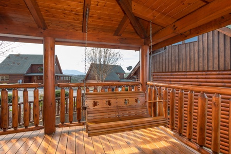 Porch swing at Better View, a 4 bedroom cabin rental located in Pigeon Forge