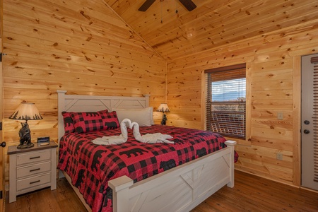 Bedroom with two night stands and lamps at Pinot Splash, a 4 bedroom cabin rental located in Gatlinburg