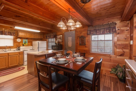 Dining table for four at Beary Good Time, a 1-bedroom cabin rental located in Pigeon Forge
