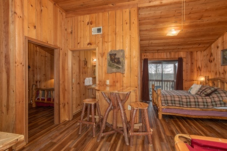 Loft bedroom with high top table at Papa Bear, a 3 bedroom cabin rental located in Pigeon Forge