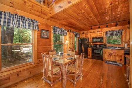 Dining room and kitchen at Misty Mountain Escape, a 2 bedroom cabin rental located in Gatlinburg