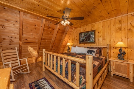 Main floor king bed at Cozy Mountain View, a 1 bedroom cabin rental located in Pigeon Forge