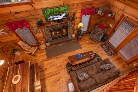 Looking down at the living room at Moonshiner's Ridge, a 1-bedroom cabin rental located in Pigeon Forge
