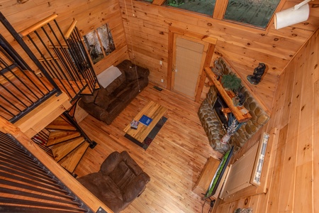 Living room from the game loft at Dreams Do Come True, a 1-bedroom cabin rental located in Pigeon Forge