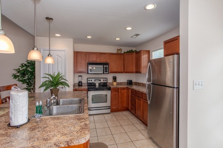 Kitchen with stainless steel appliances at A Pigeon Forge Retreat, a 2 bedroom cabin rental located in Pigeon Forge