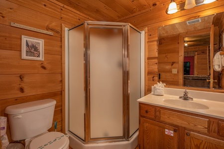 Bathroom with a corner shower at Logan's Smoky Den, a 2 bedroom cabin rental located in Pigeon Forge