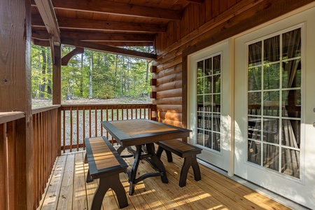 Picnic table on the deck at Gar Bear's Hideaway, a Pigeon Forge cabin rental