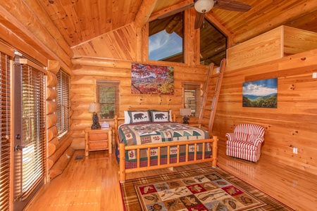 King bedroom with an additional sleeping loft at Great View Lodge, a 5-bedroom cabin rental located in Pigeon Forge