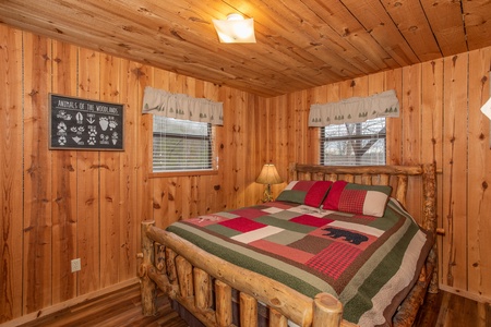 Bedroom with a log bed at Papa Bear, a 3 bedroom cabin rental located in Pigeon Forge