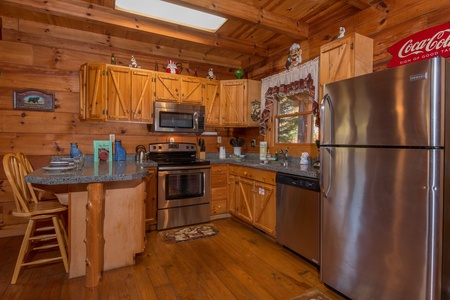 Kitchen with stainless appliances at Hawk's Nest, a 1 bedroom cabin rental located in Pigeon Forge