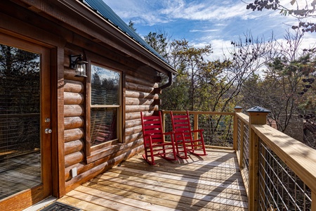 Rocking chairs on the deck at Bear Feet Retreat, a 1 bedroom cabin rental located in pigeon forge